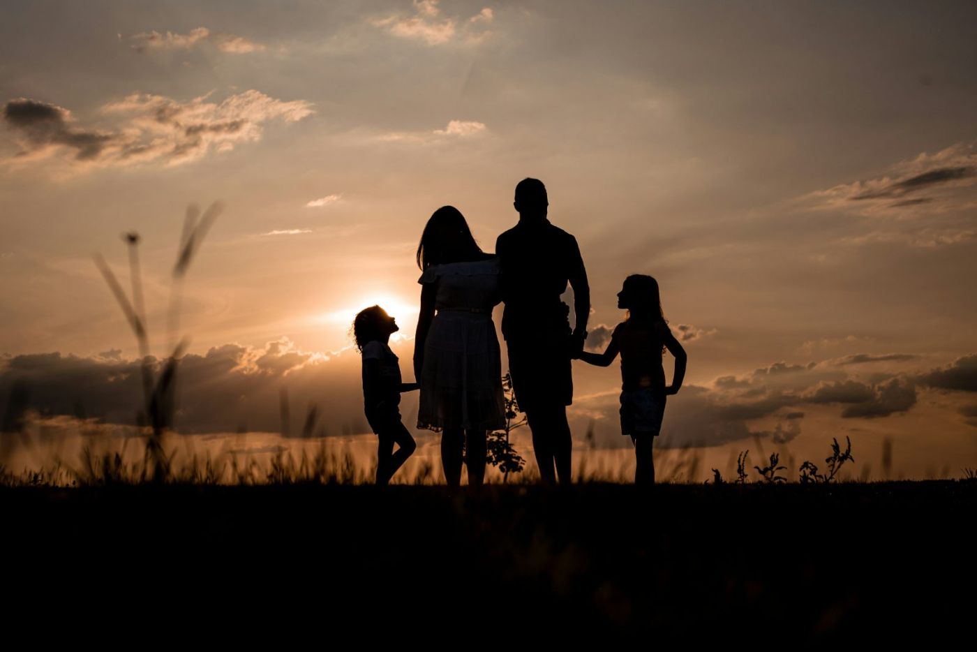 Local Las Vegas family together at sunset outside their home