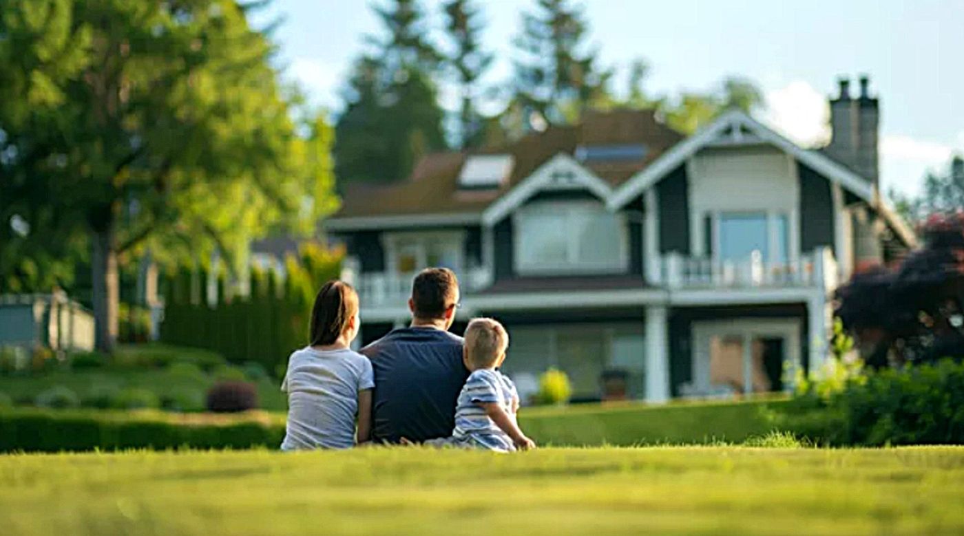 A Las Vegas family in front of their home, protected by Valley West Insurance